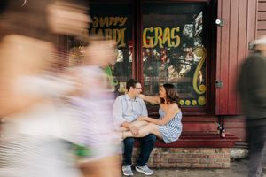 A series of dynamic motion blur photographs showing people interacting in front of a graffiti-covered wall.