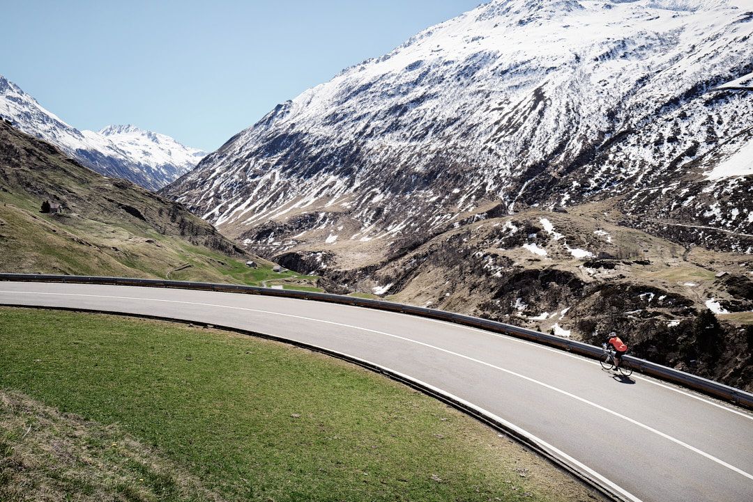 Lifestyle photography: Cycling in Switzerland. Location: Oberalp Pass. Photo by Dayle Prowse.