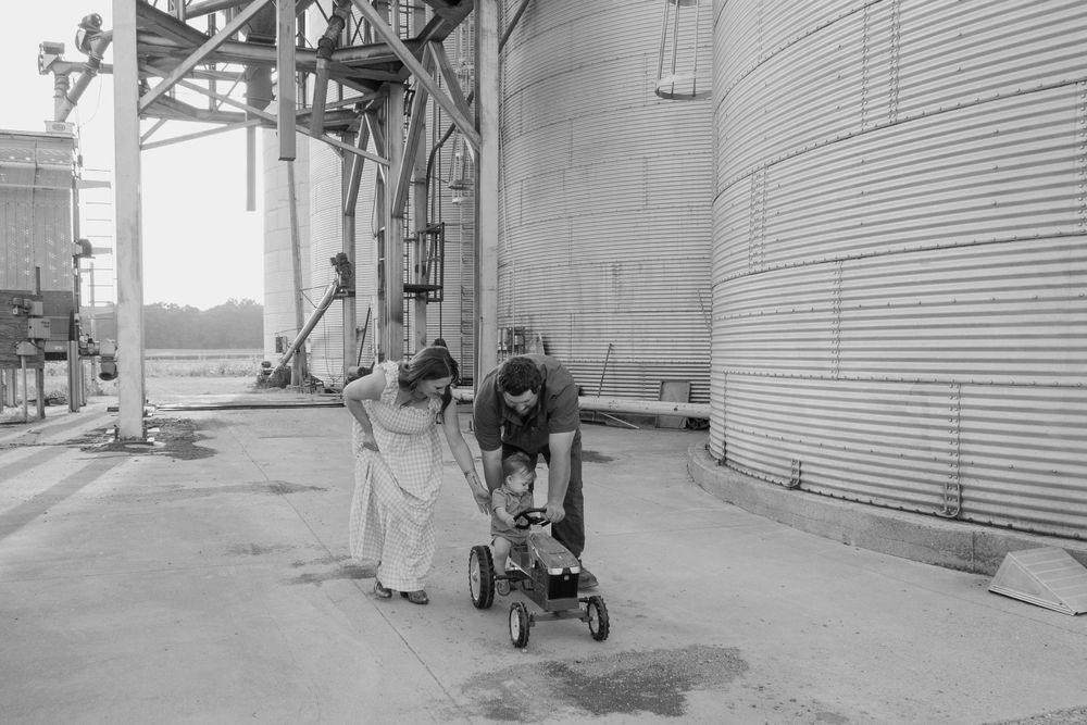 Vintage black and white photo of a grain elevator or industrial facility.