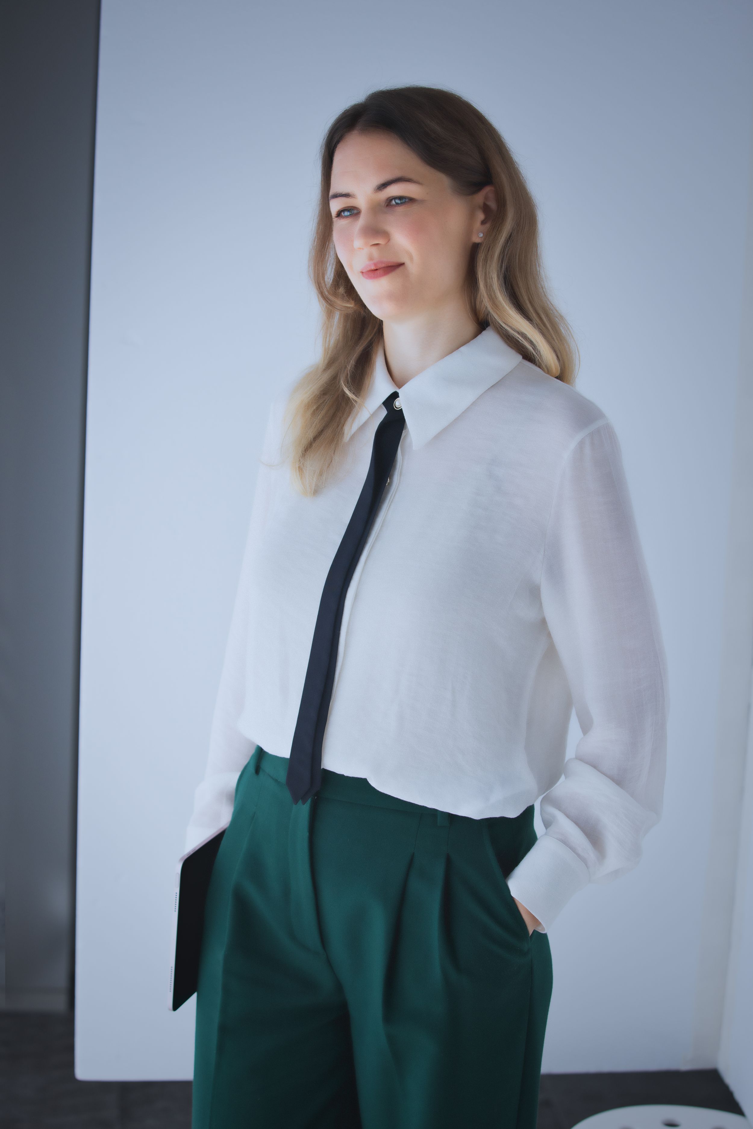 Professional business headshot of a woman in Paris with confident expression