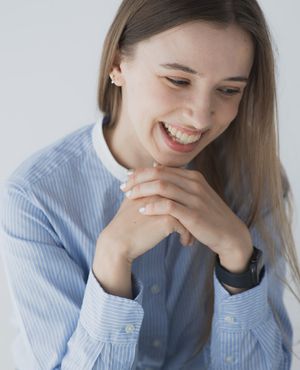 Professional headshot of young entrepreneur in Paris office environment