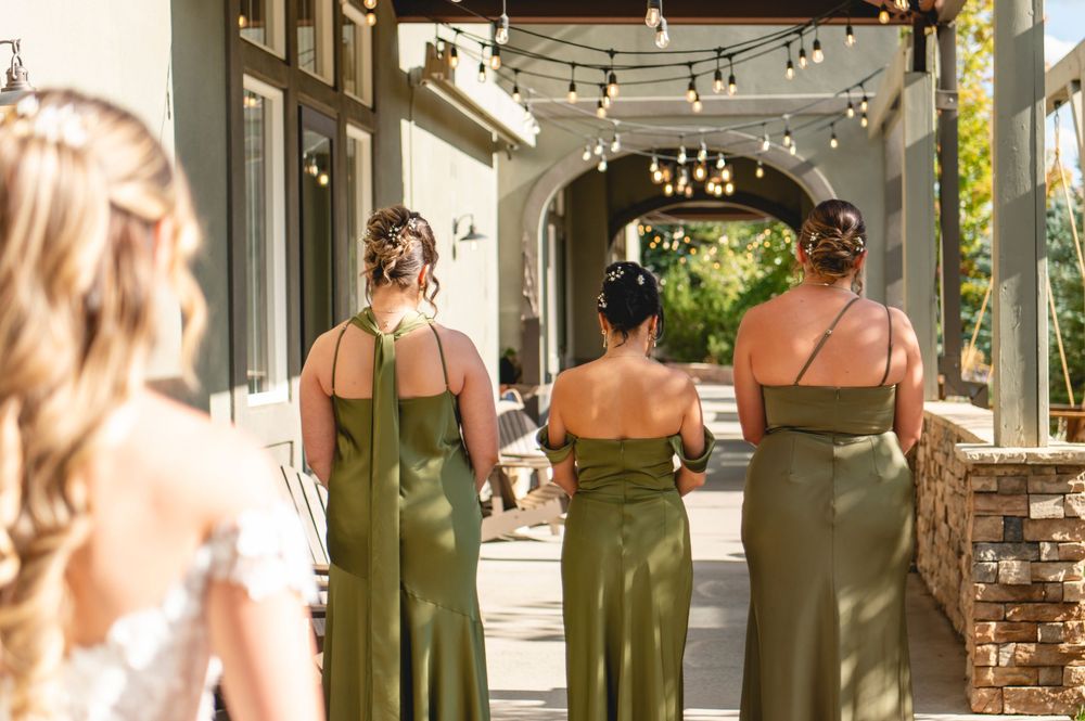 Romantic rustic wedding venue with string lights and stone pillars showcasing intimate couple photos at sunset.