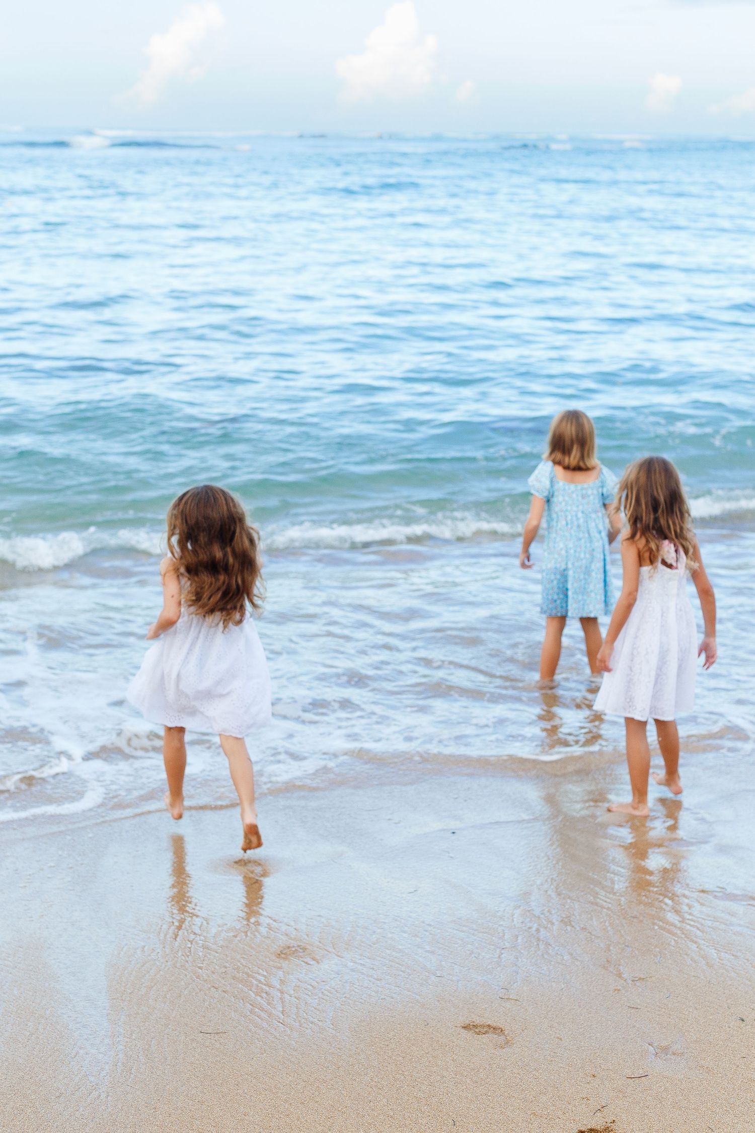 Three girls on the beach in Dorado, Puerto Rico.