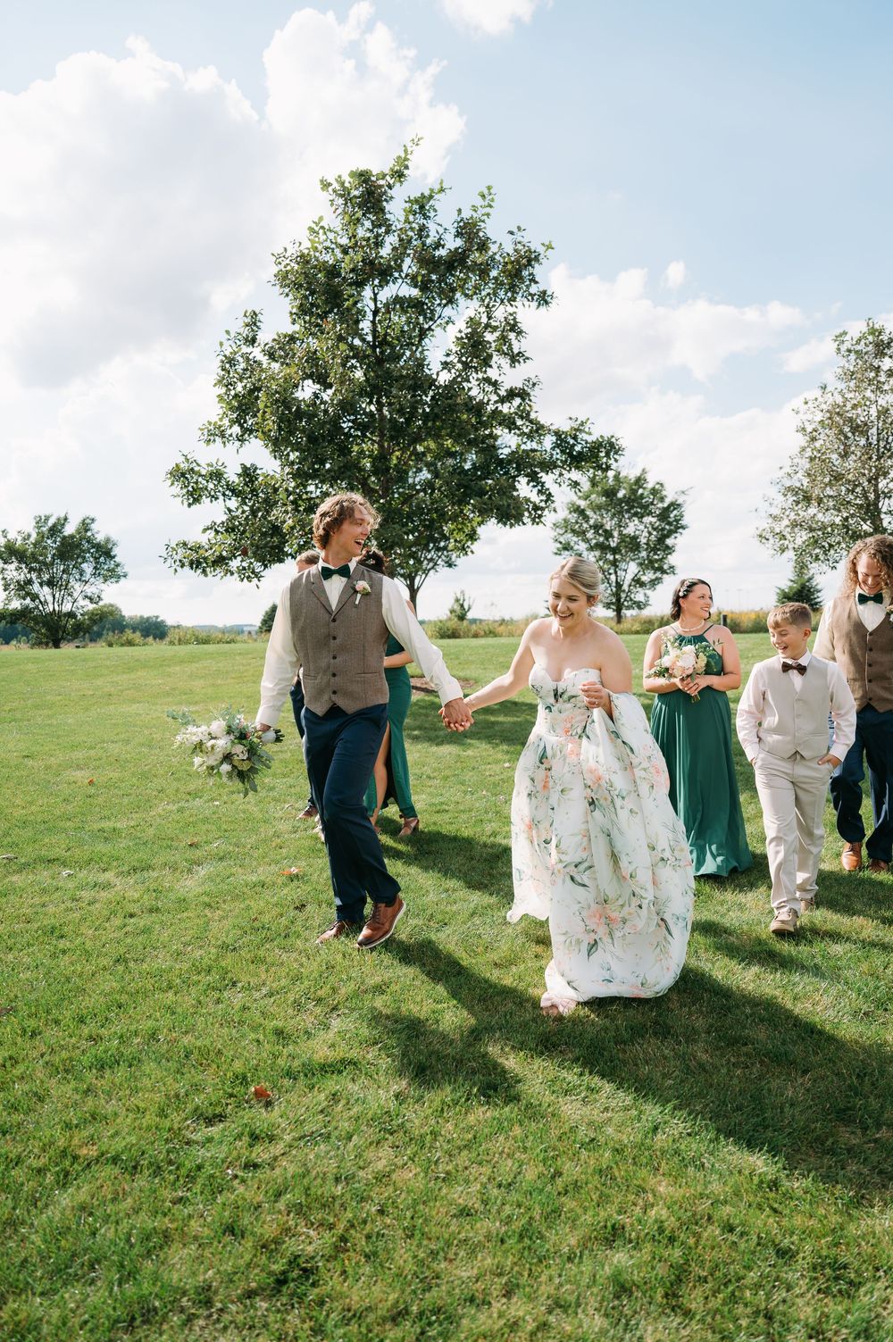 bridal party walking at Lowe Park Marion Iowa taken by cedar rapids midwest wedding photographer