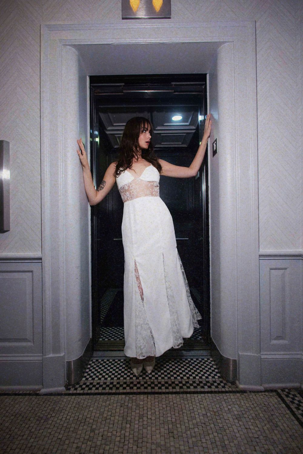 A sequence of four photos shows someone in a white dress appearing to be pushed into an elevator by an unseen force.