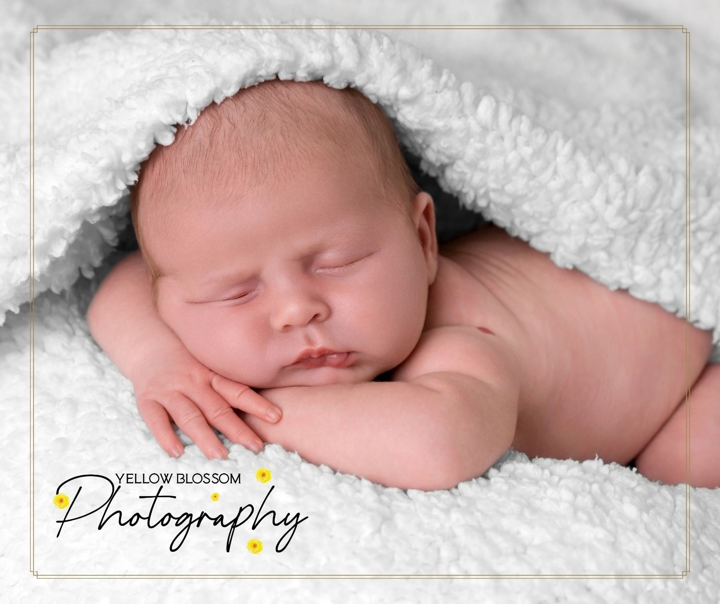 Newborn baby wrapped in soft blanket – professional baby photographer Suffolk