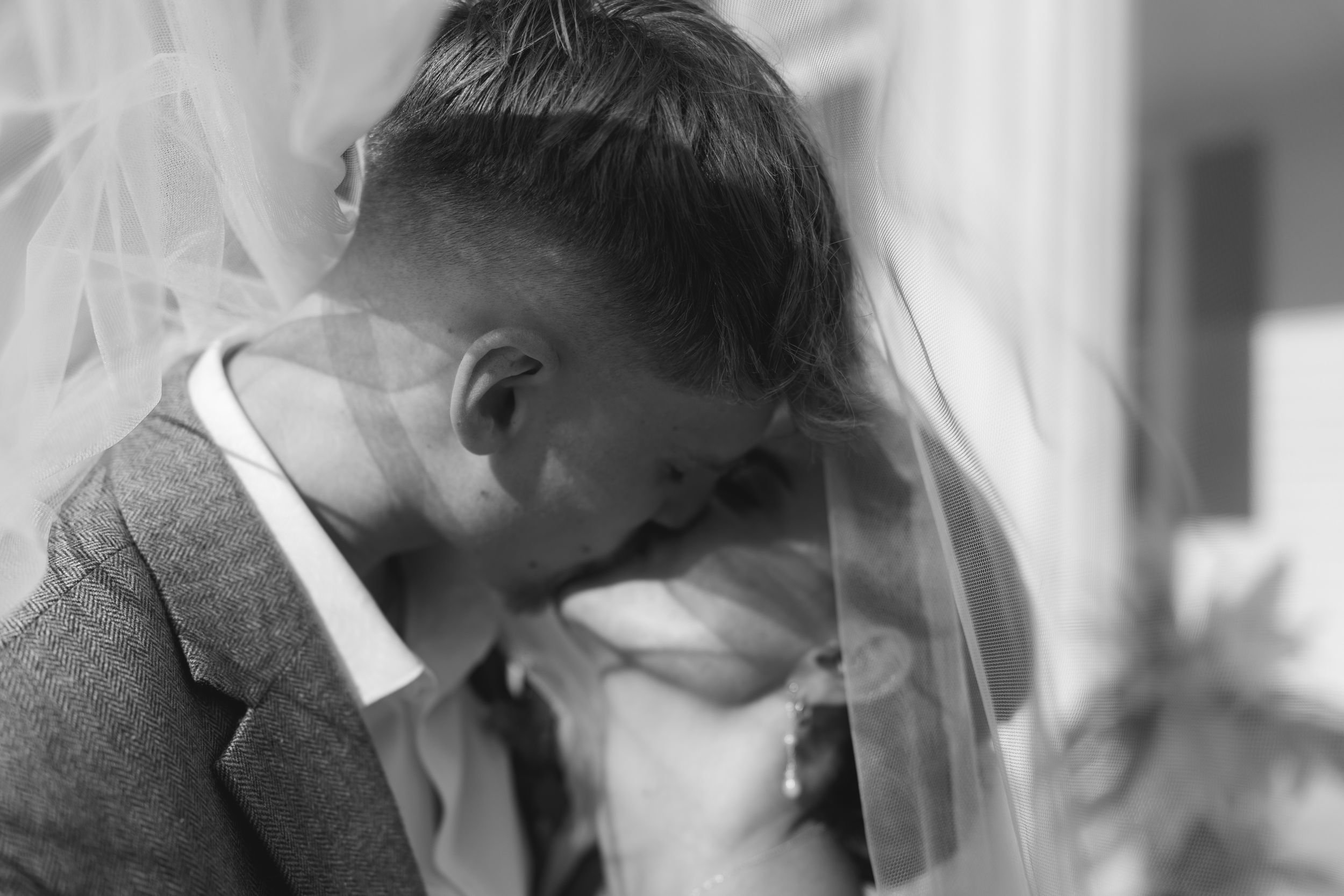 A sequence of black and white photographs shows a person in emotional distress with hands covering their face.