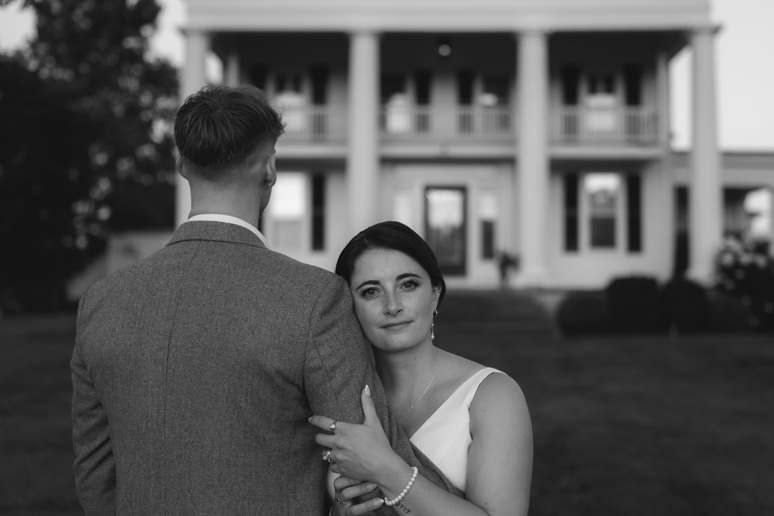 Black and white wedding photography series showing outdoor moments between newlyweds on their special day.