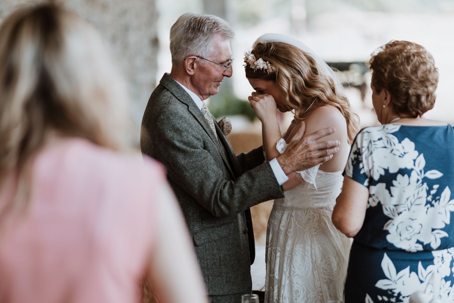Bride and her granddad having an emotional moment during drinks reception at Wilde Lodge