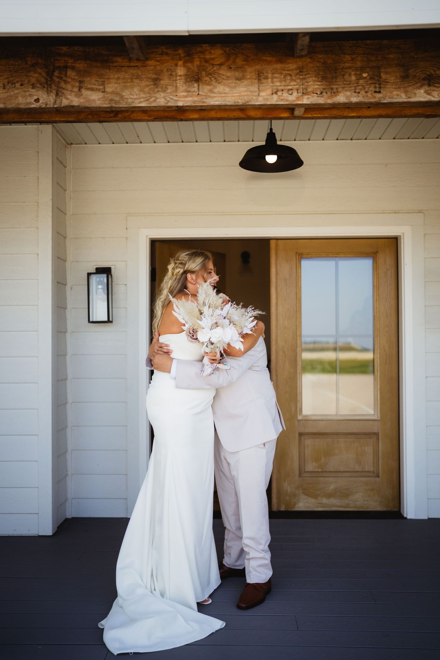 Three photos showing a sequence of a dancing couple in white formal attire on a porch during their wedding day celebration.