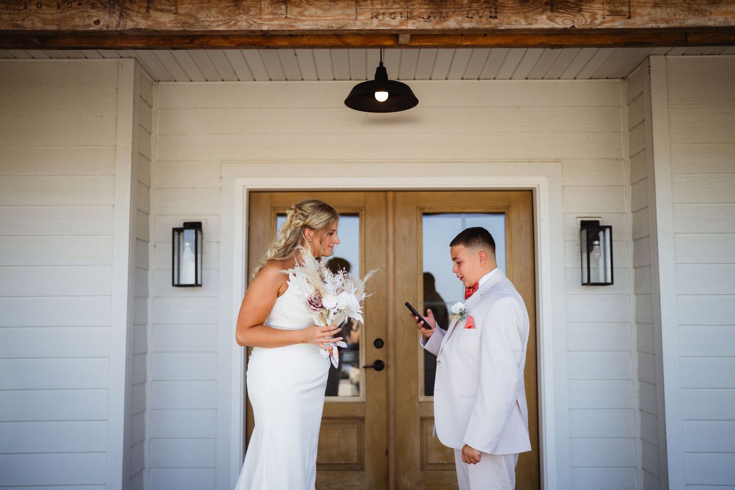 Four side by side wedding photos showing romantic moments between the couple at their barn venue ceremony.