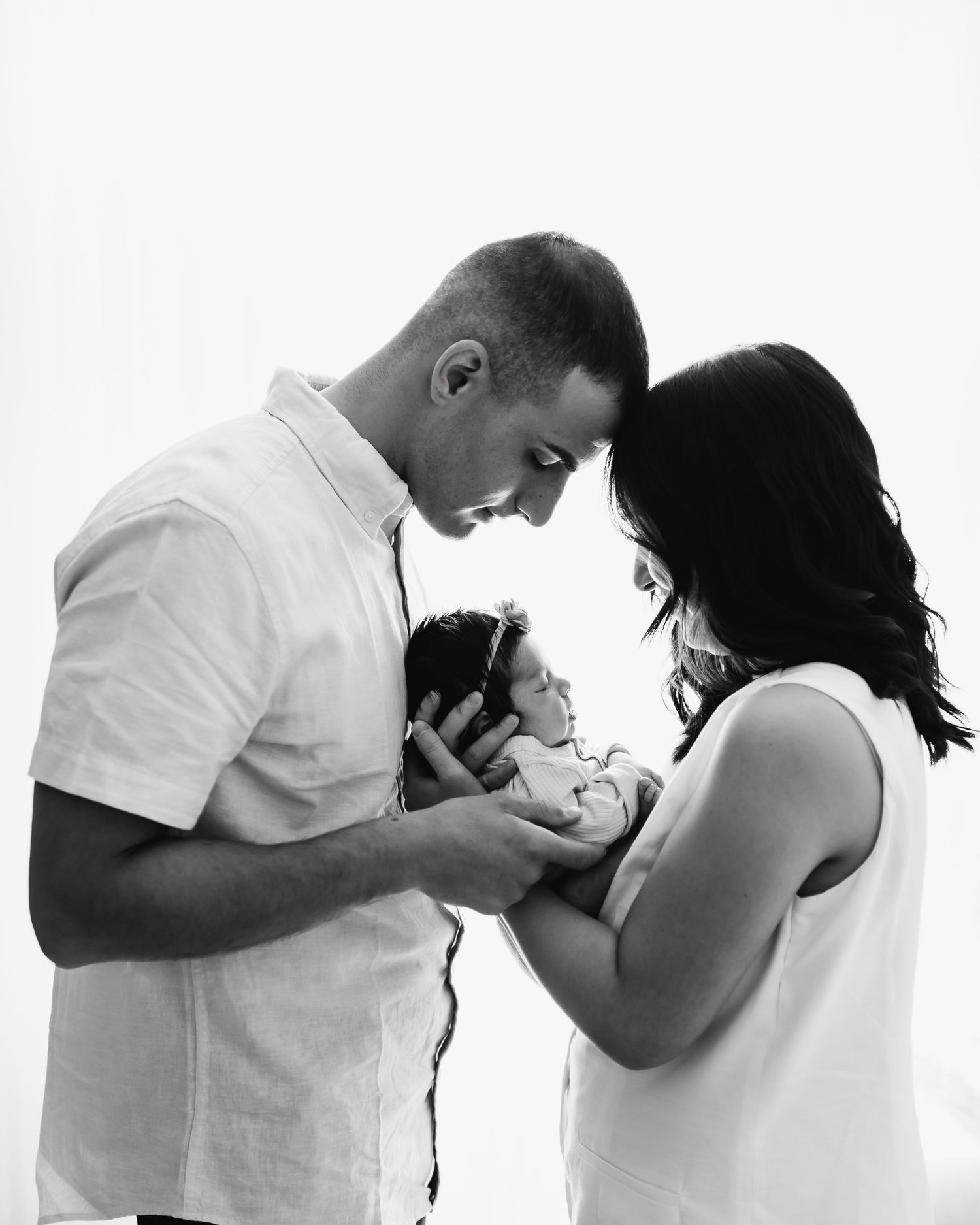 black and white photos during newborn session at the studio in Denver Colorado