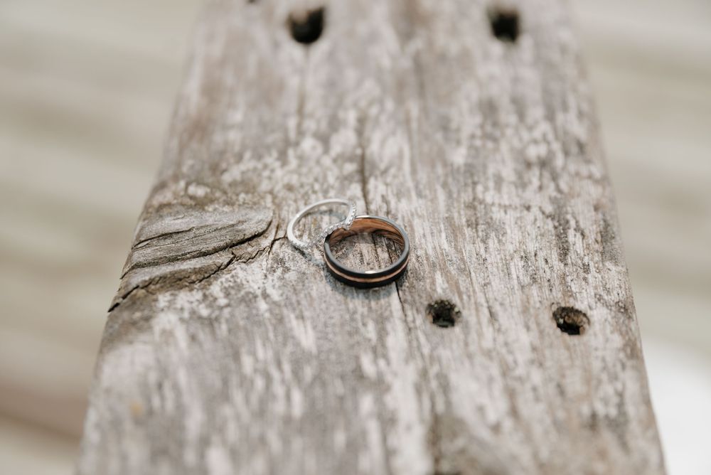 Close-up detail of weathered wood texture with rustic nail holes.