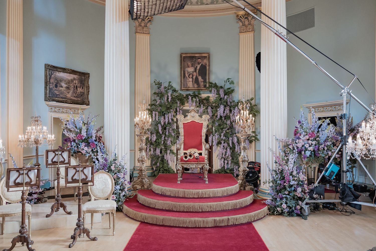 Behind the scenes of a Bridgerton Netflix filming setup at Newark Town Hall, showing showing the throne area set up with media equipment.