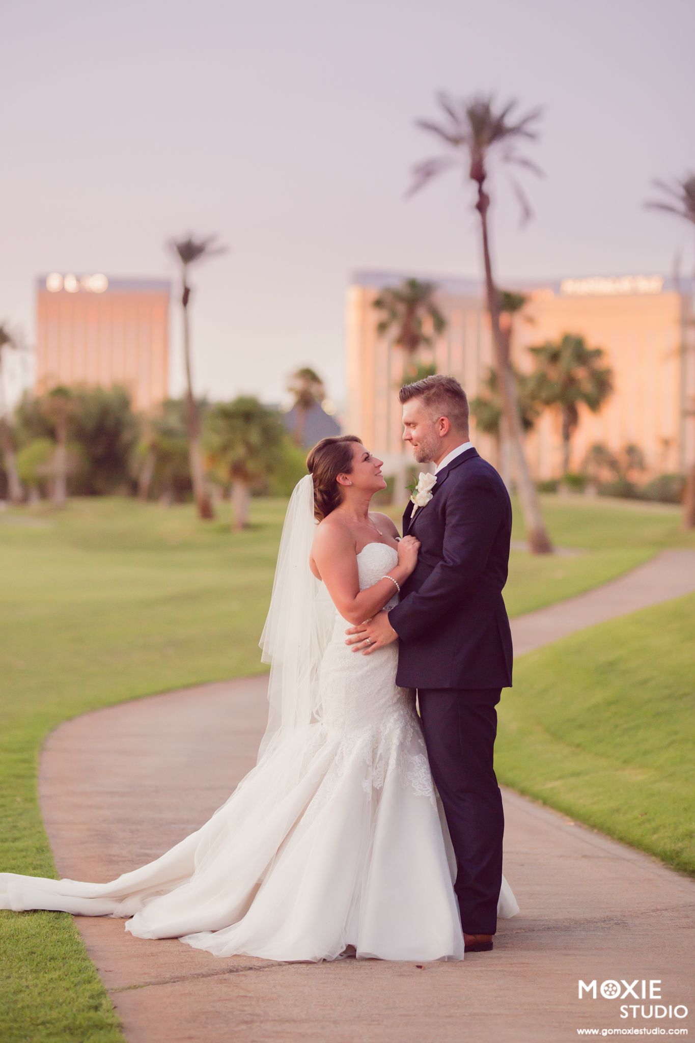 bride and groom portraits at DragonRidge Country Club sunset