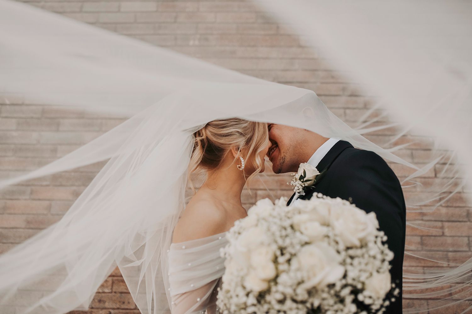 Bride and groom romantic portrait inside industrial wedding venue