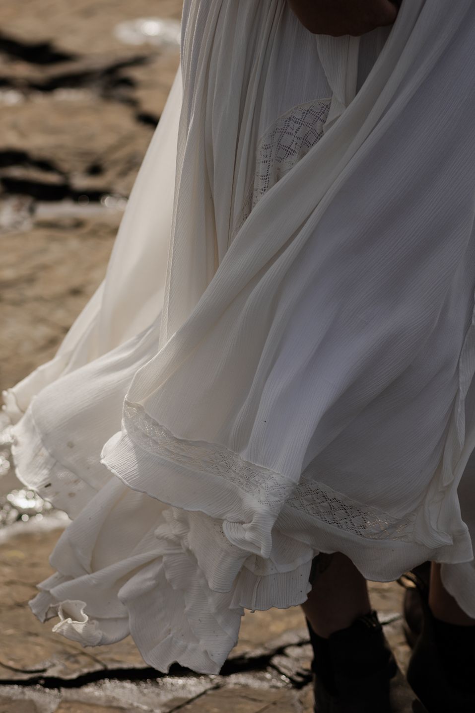 Bride dress blowing in coastal wind during Hags Head elopement portraits