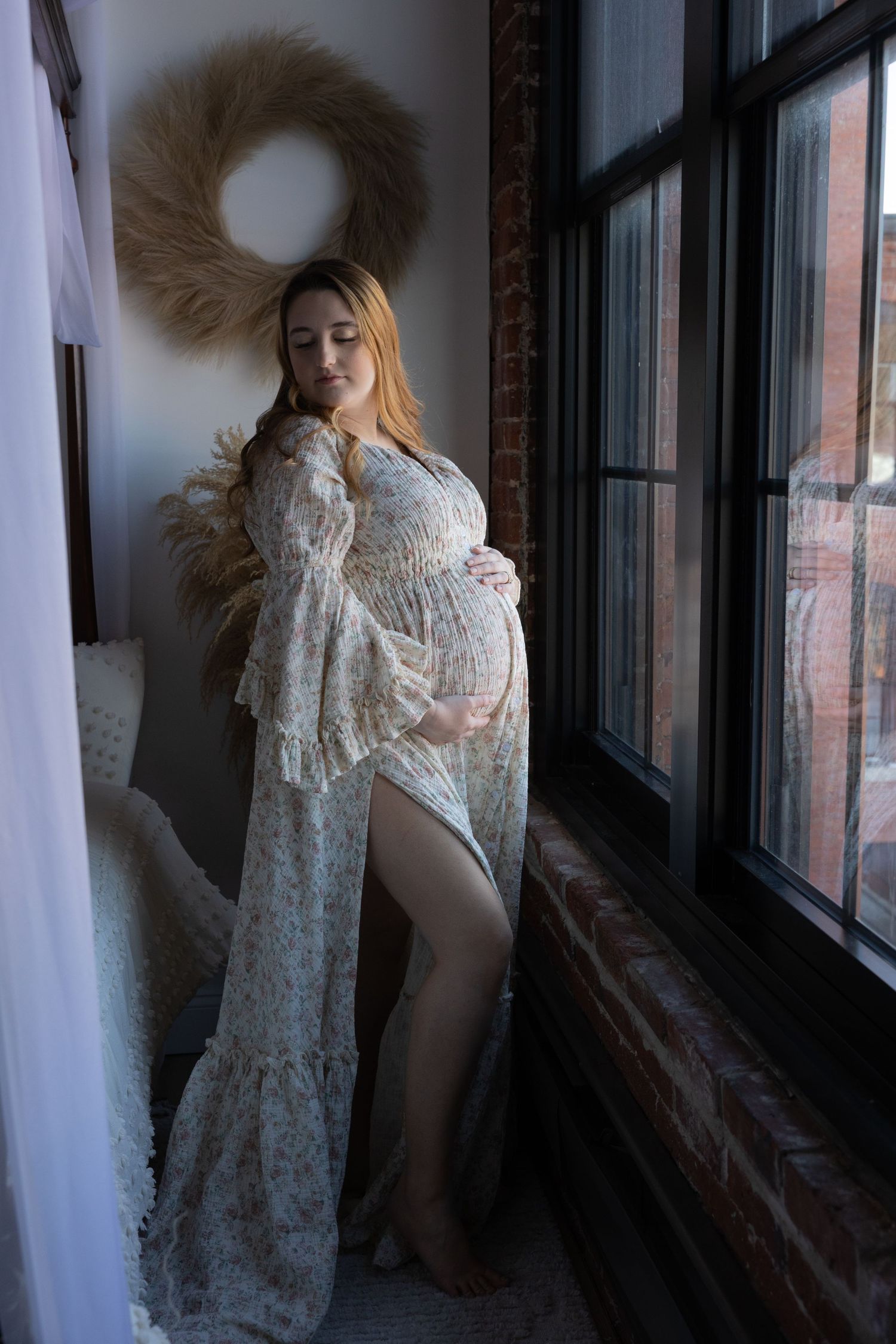 Dreamy boudoir photography with vintage-inspired lace dress and dramatic window lighting.