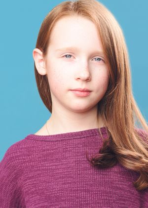 Portrait sequence against blue background showing person in burgundy sweater with styled hair.