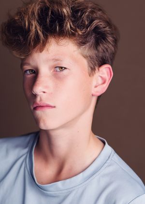 A series of profile portraits showing a person in a light blue shirt with tousled brown hair against a brown backdrop.
