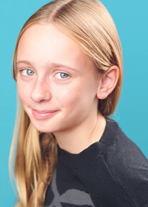 A series of four close-up portrait shots showing different expressions against a bright blue background.