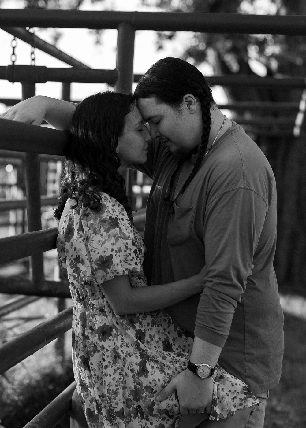 A black and white portrait of an intimate moment between two people.