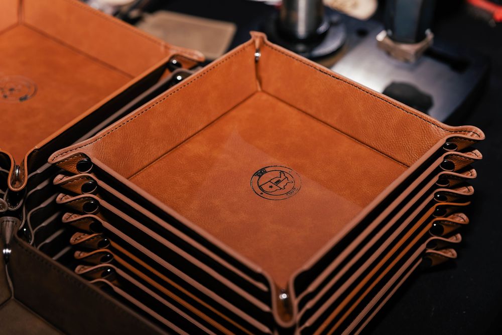Close-up of copper-colored metallic circuit board patterns or decorative elements.
