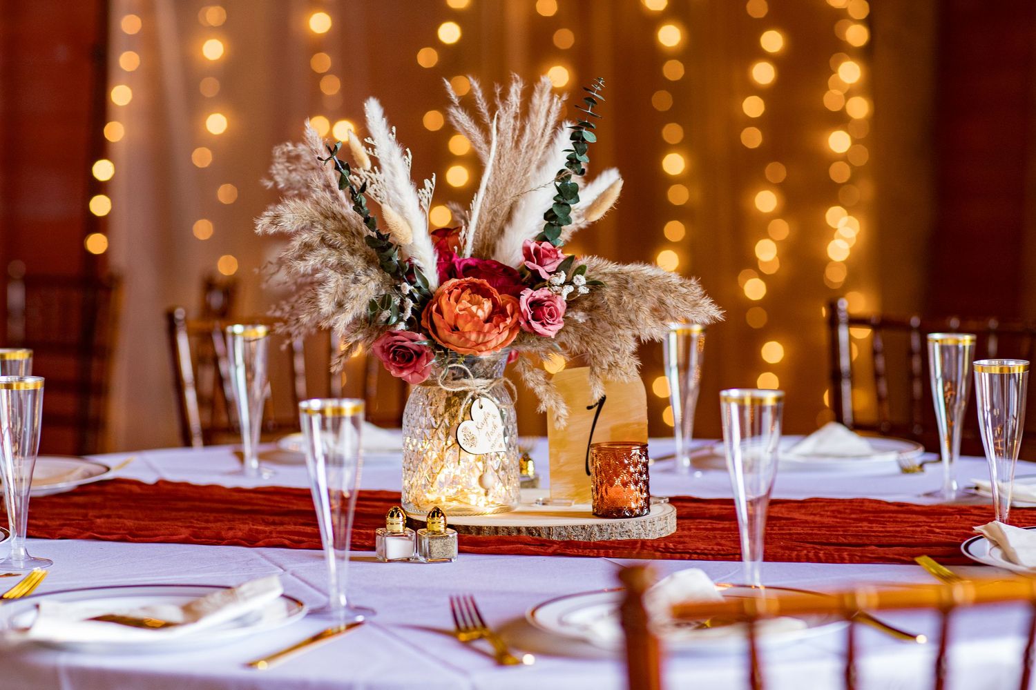 frederick maryland wedding phoWedding reception tables decorated with warm lighting and floral centerpieces creating an intimate atmosphere.