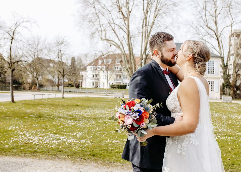 A series of romantic wedding photos showing tender moments between newlyweds in an outdoor spring setting.