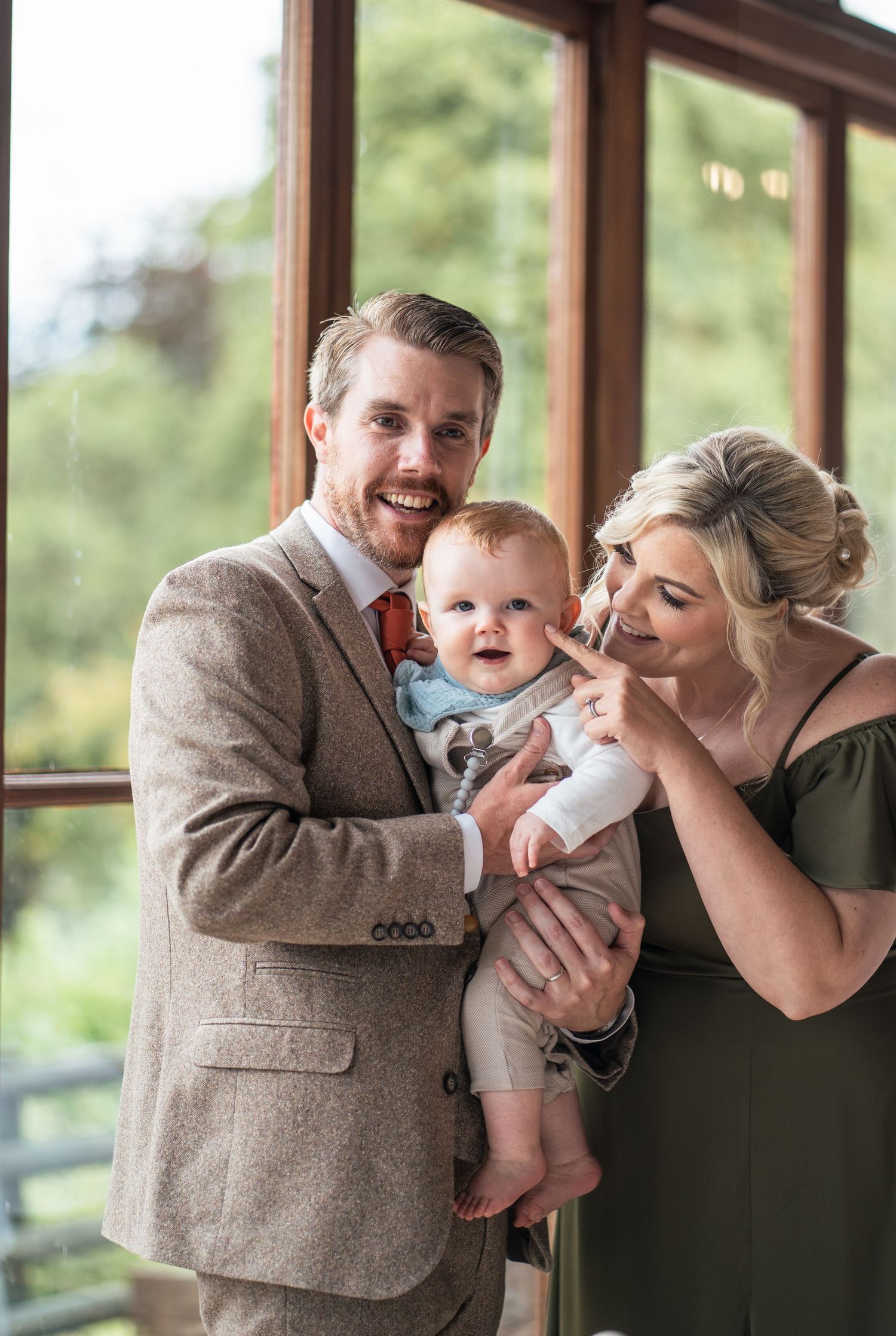 A series of three candid moments showing parents sharing tender moments with their baby by a window.