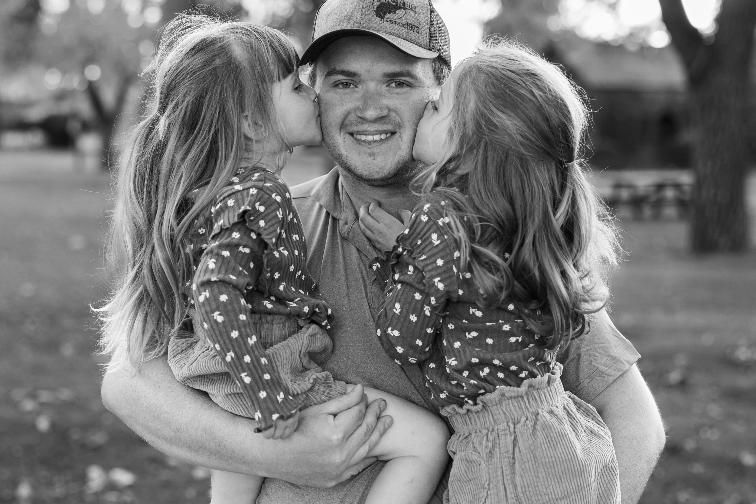 Black and white family portrait outdoors in Fort Benton Chouteau County Montana family photoshoot fun photography loving special moments
