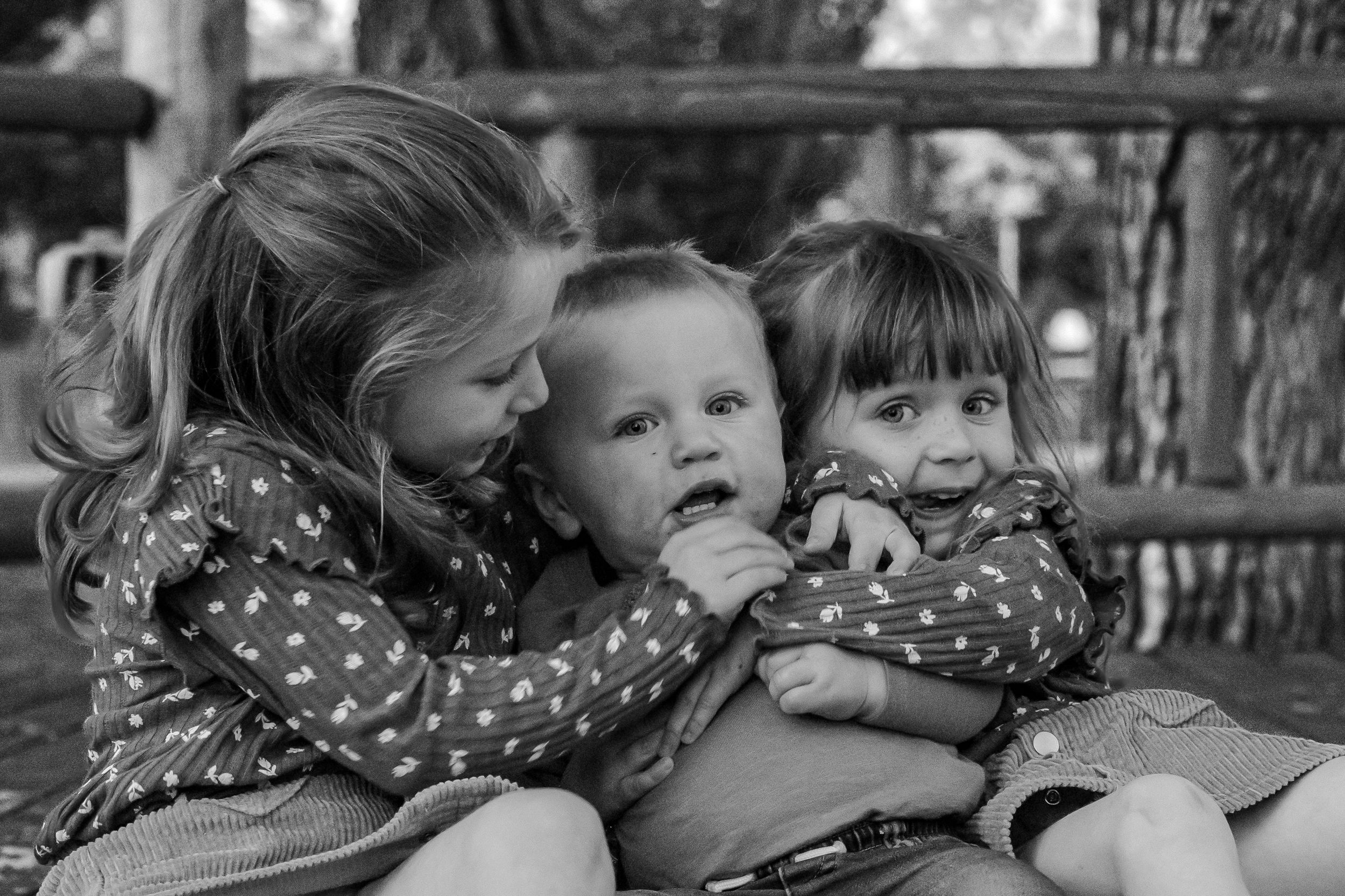 Black and white family portrait outdoors kids Fort Benton Chouteau County Montana family photoshoot fun photography loving special moments