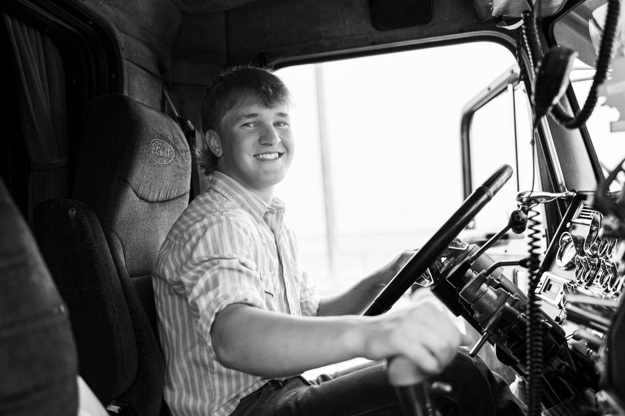 Personalized high school senior photoshoot in semi truck, unique original fun showcasing you in your element Fort Benton Chouteau County