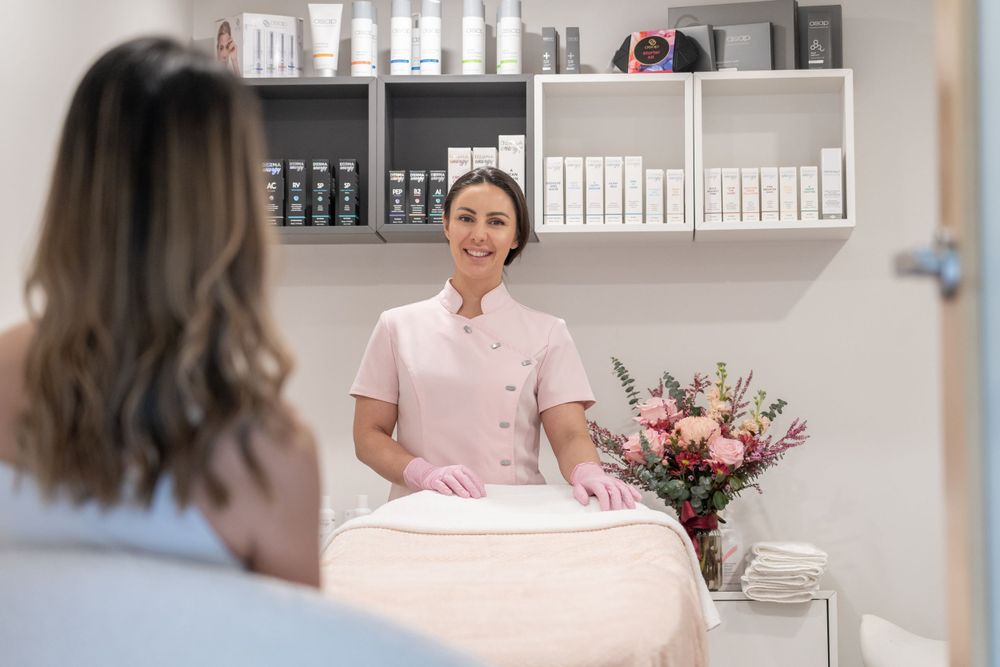 Modern beauty salon interior with shelving displaying professional skincare products.