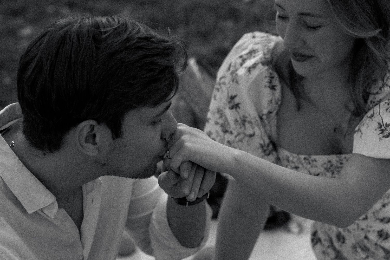 A series of candid romantic moments photographed in black and white.