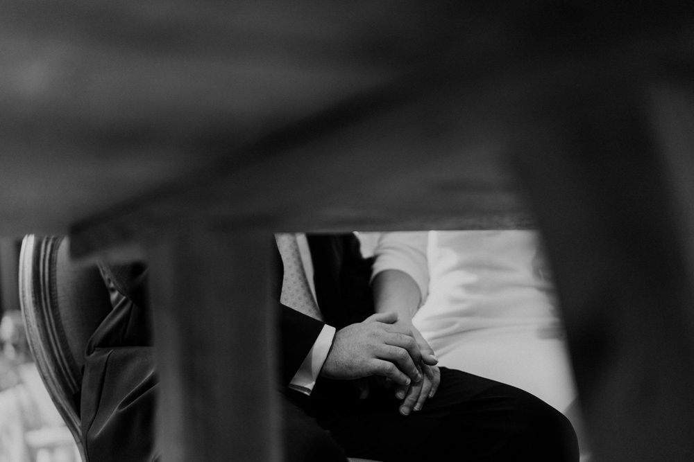 Wedding rings detail captured during ceremony in Braga
