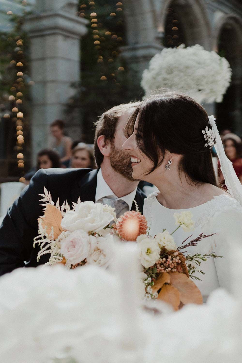 Bride and groom embracing during ceremony at Solar da Levada