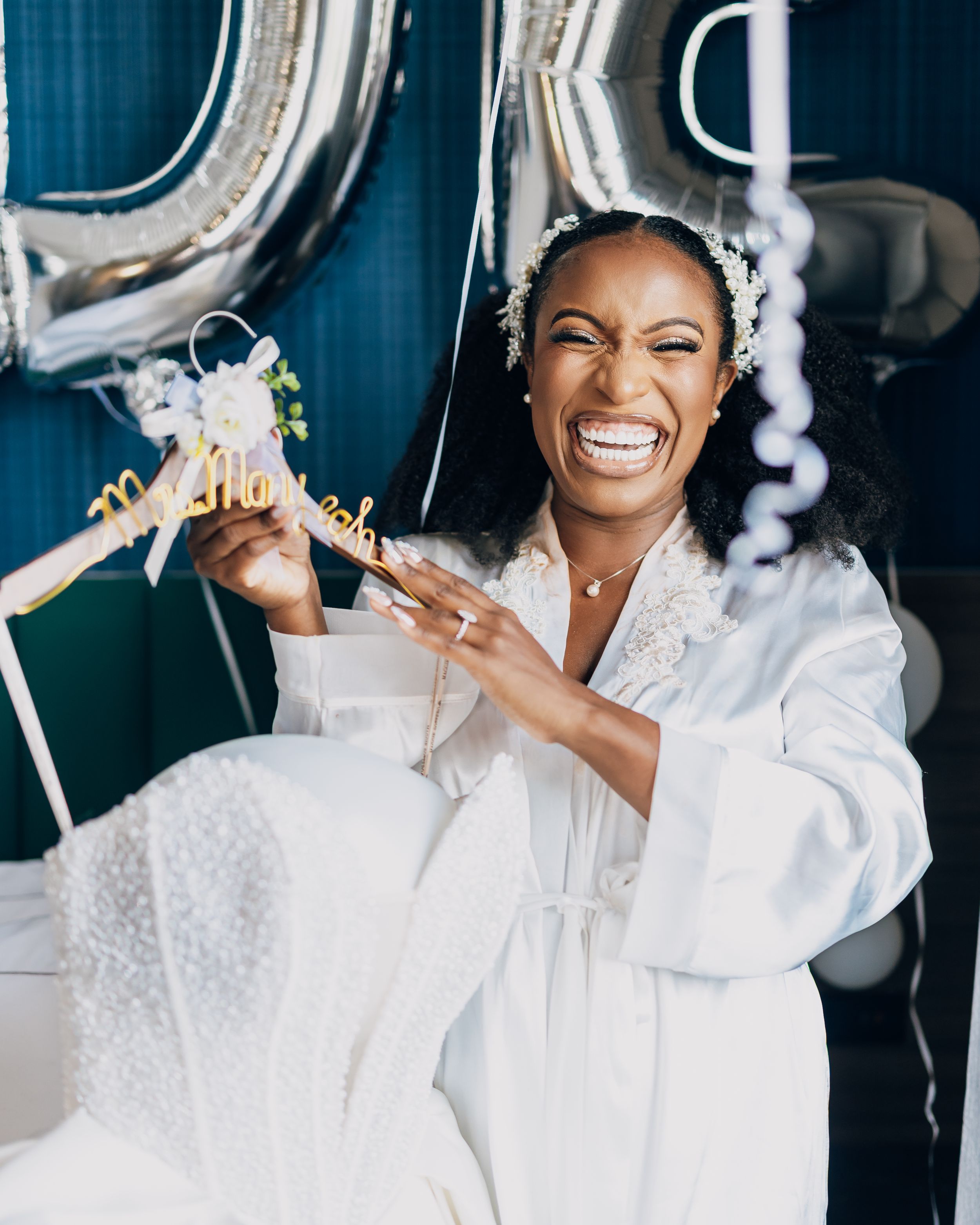 Silver balloons and decorative elements create a celebratory atmosphere during an indoor celebration.