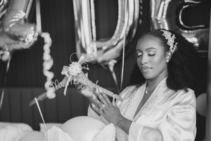 A collection of black and white wedding moments showing guests celebrating at an elegant ceremony and reception.