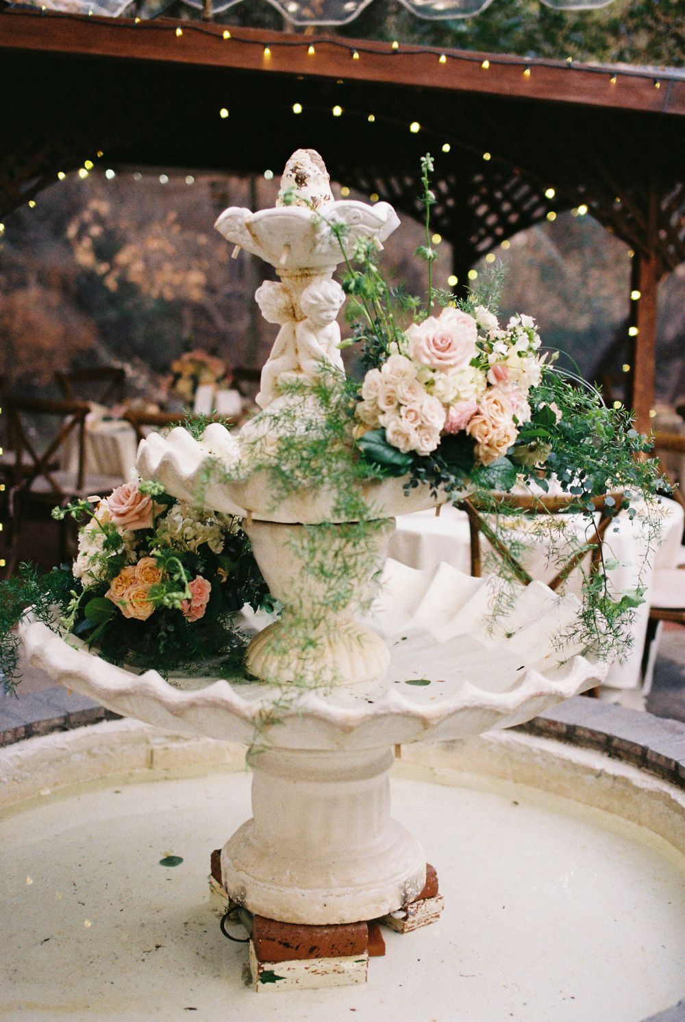fountain at inn of the seventh ray decorated with florals