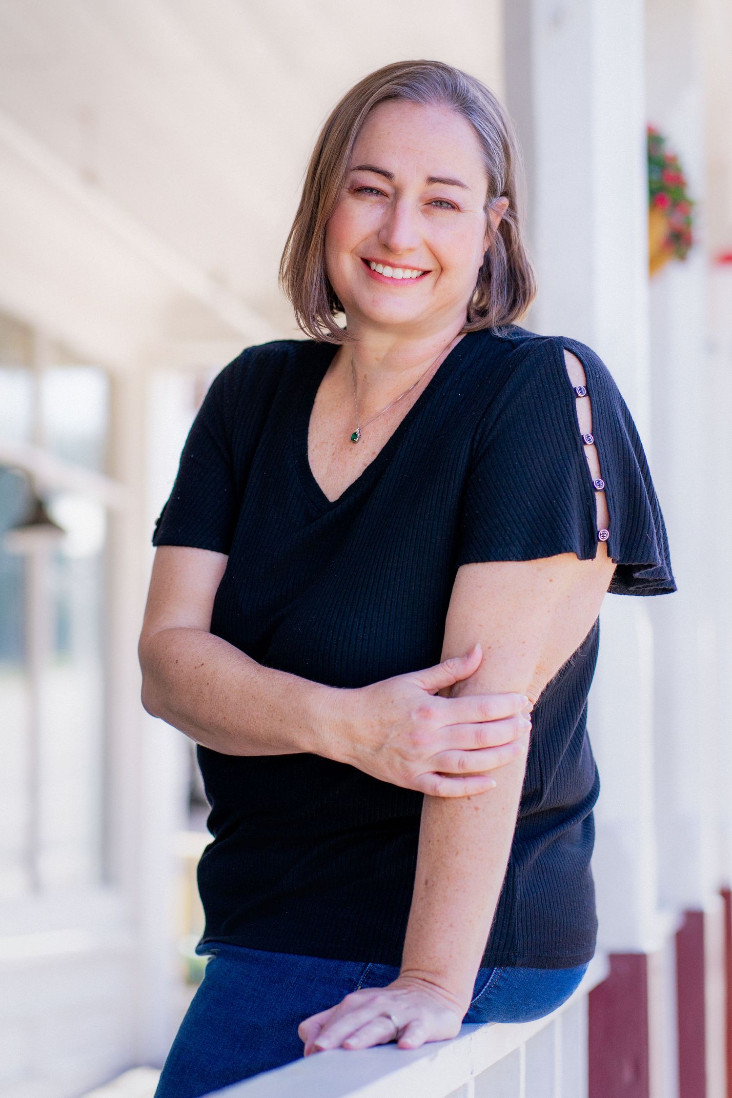 Environmental headshot of East Tennessee realtor taking in downtown Dandridge, TN by headshot and personal branding photographer