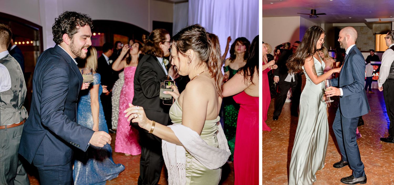 Wedding guests dance joyfully on a dimly lit dance floor during an evening reception celebration.