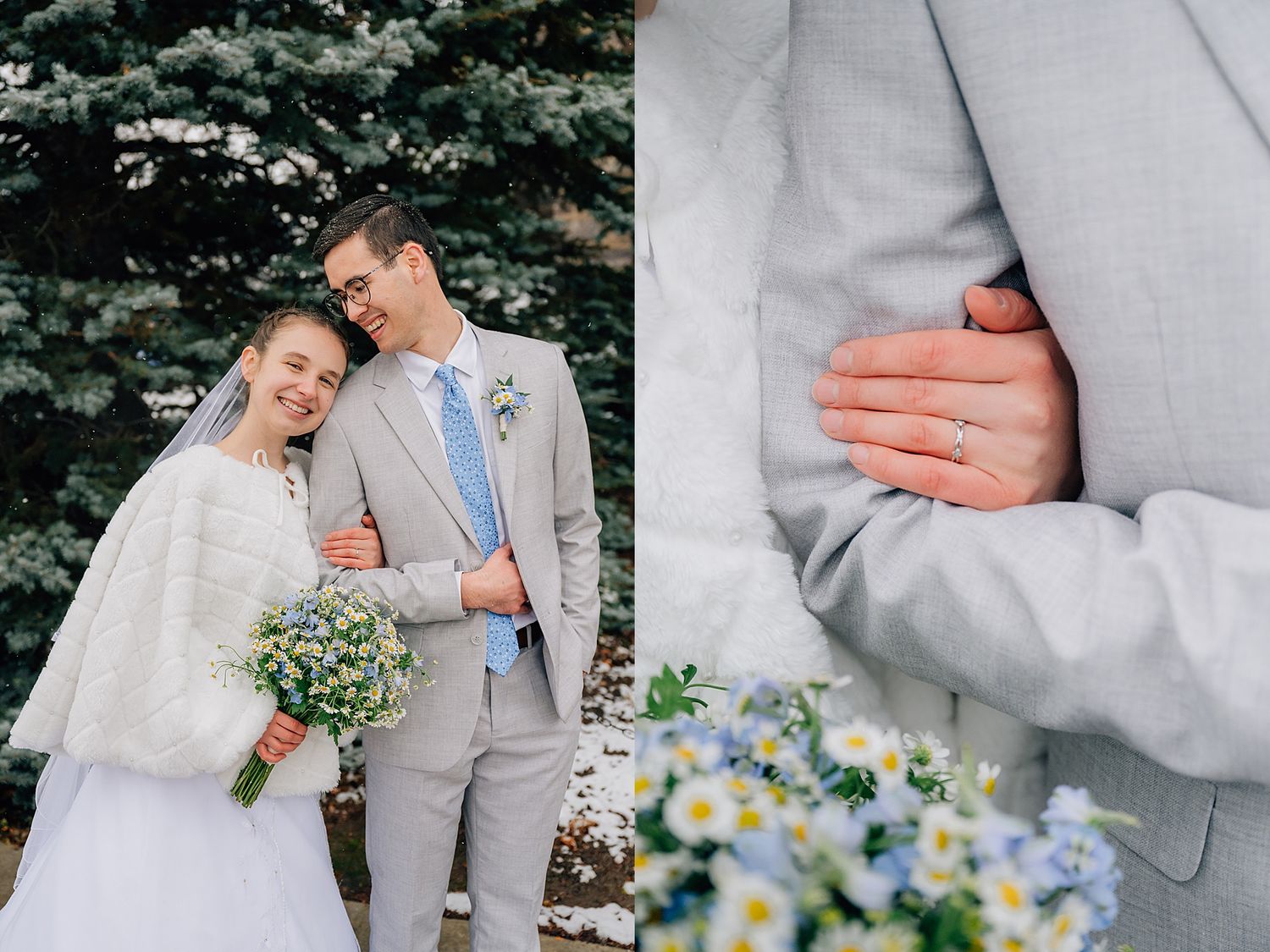 A couple in winter wedding attire pose with a bouquet of blue flowers against spruce trees.