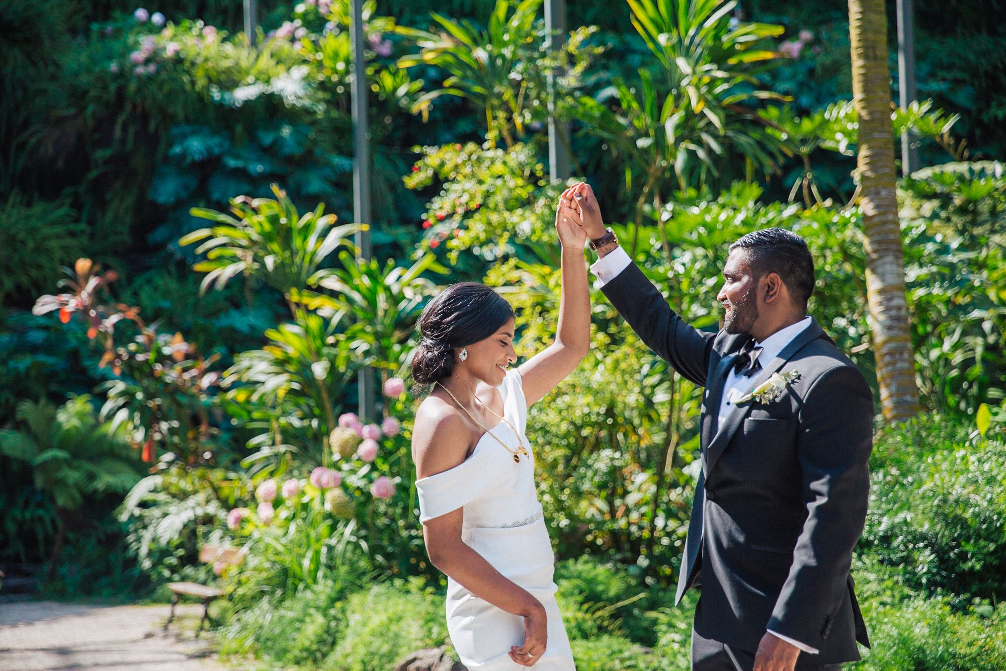 indian couple at estufa fria venue, bride in white and groom in tuxedo, photographed by a destination wedding photographer in Portugal