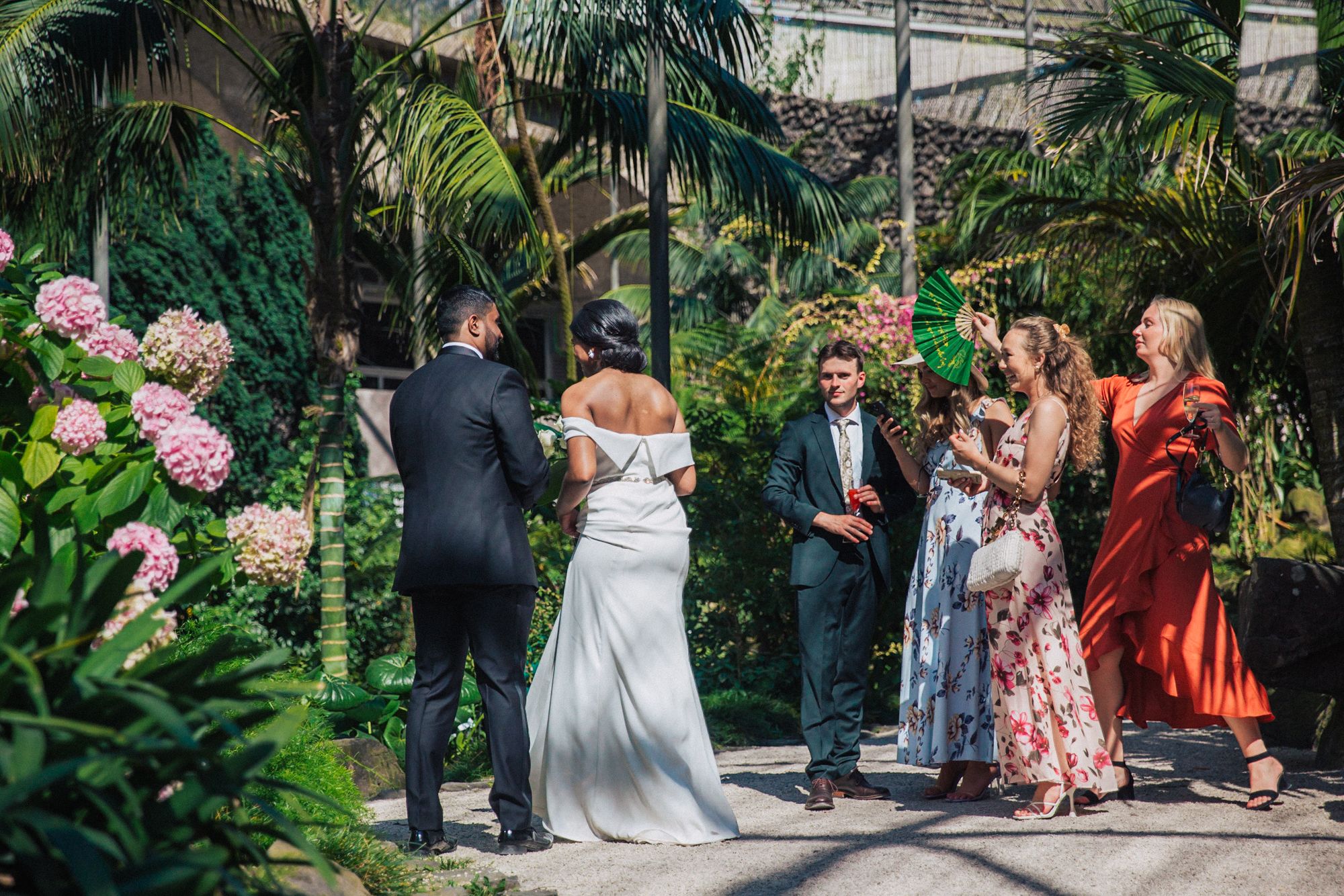 indian couple at estufa fria venue, bride in white and groom in tuxedo, photographed by a destination wedding photographer in Portugal