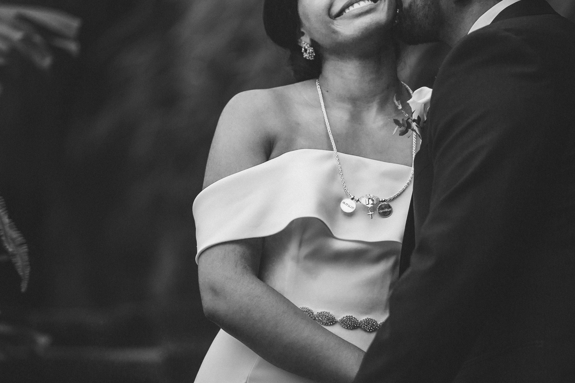 indian couple at estufa fria venue, bride in white and groom in tuxedo, photographed by a destination wedding photographer in Portugal