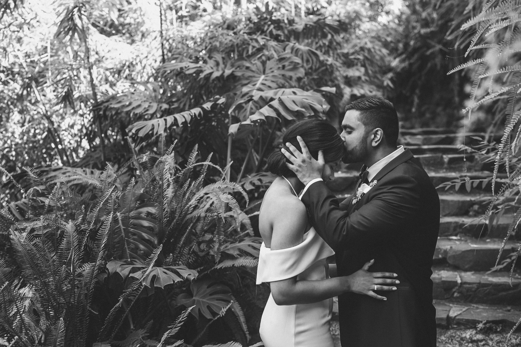 indian couple at estufa fria venue, bride in white and groom in tuxedo, photographed by a destination wedding photographer in Portugal
