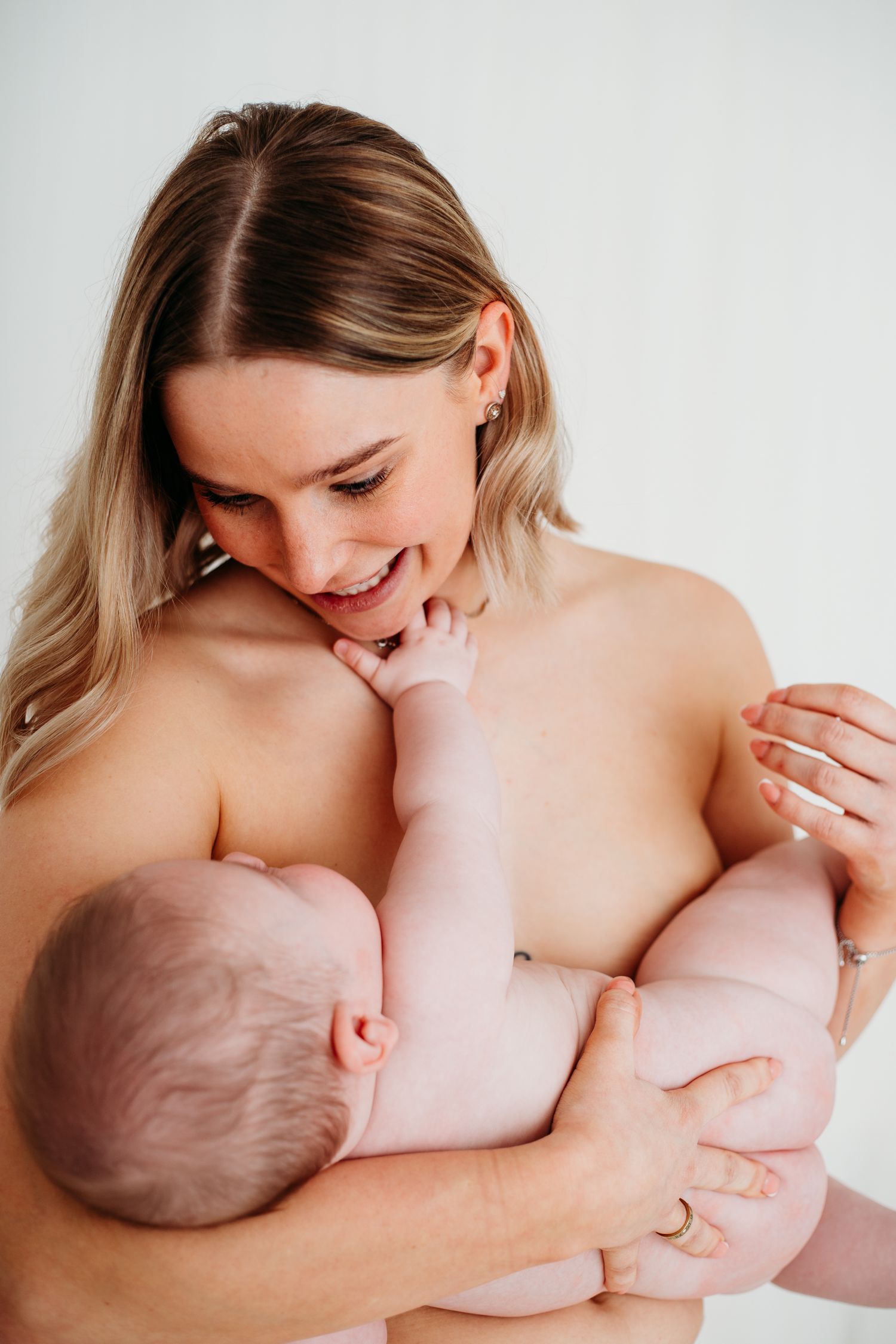 Parent and baby bonding moment captured in Mapperley photography studio, Nottingham family photographer creating heartfelt portraits.