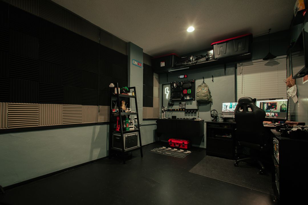 Mannyportraits Miami creative studio with cinematic editing desk, gear wall, and soundproof panels designed for focused storytelling.