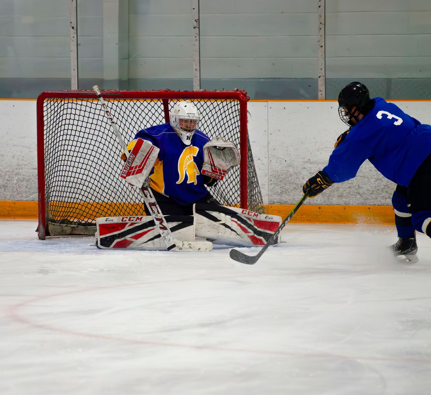 goalie makes big save hockey action shot photography